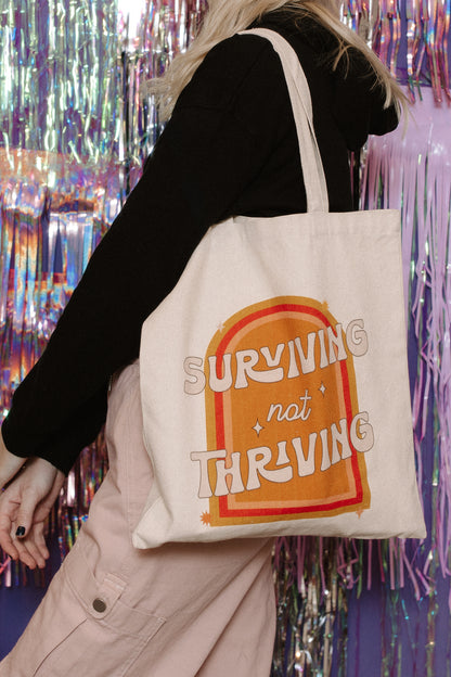 Surviving Not Thriving Tote Bag